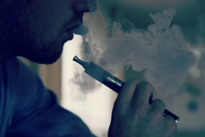 E-cigarette with vapor coming out