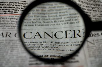 Cancer written on a newspaper