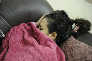 Woman sleeping on couch