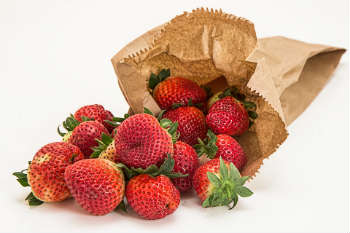 Strawberries in brown bag